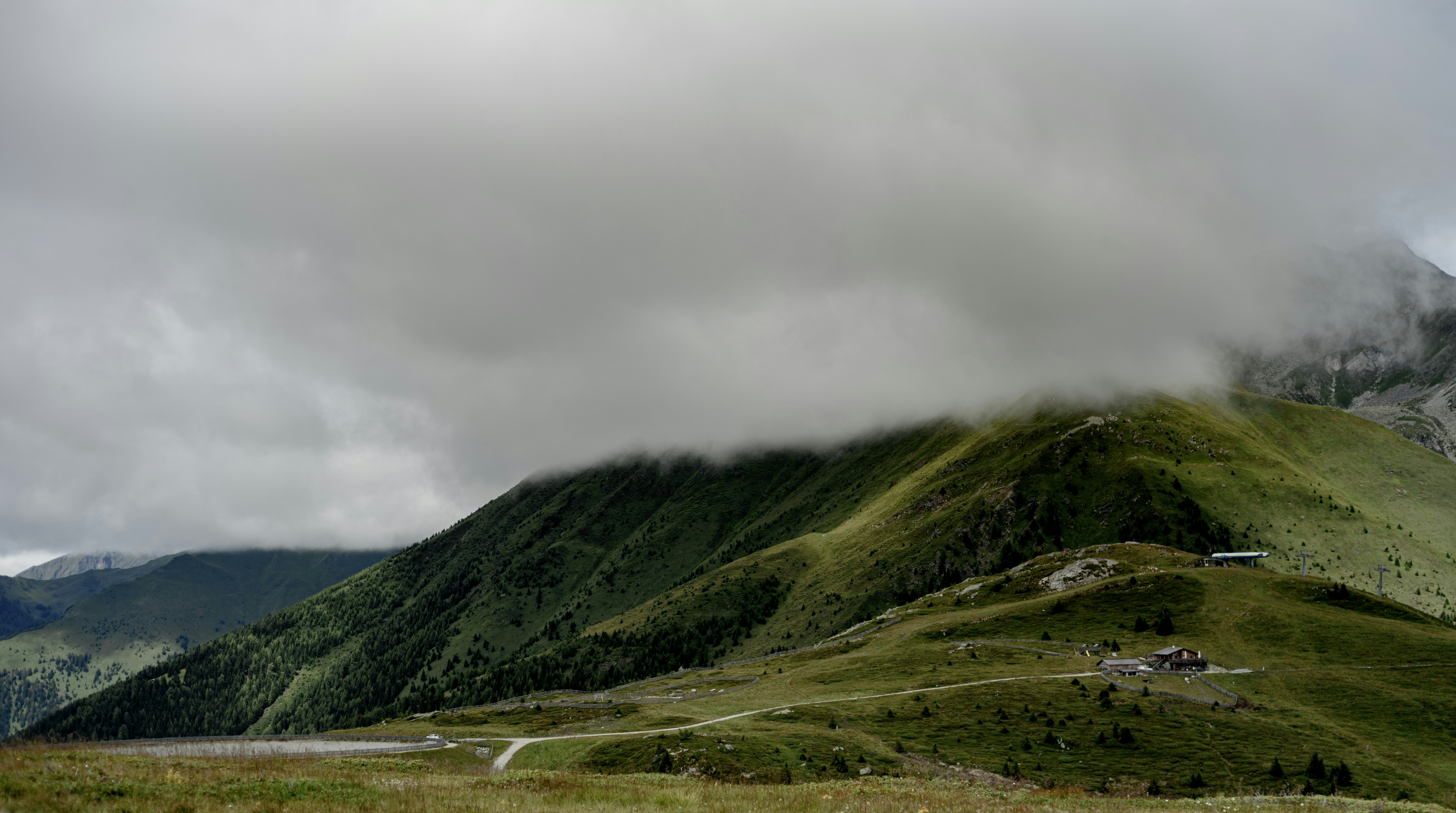 green mountain under white clouds during daytime